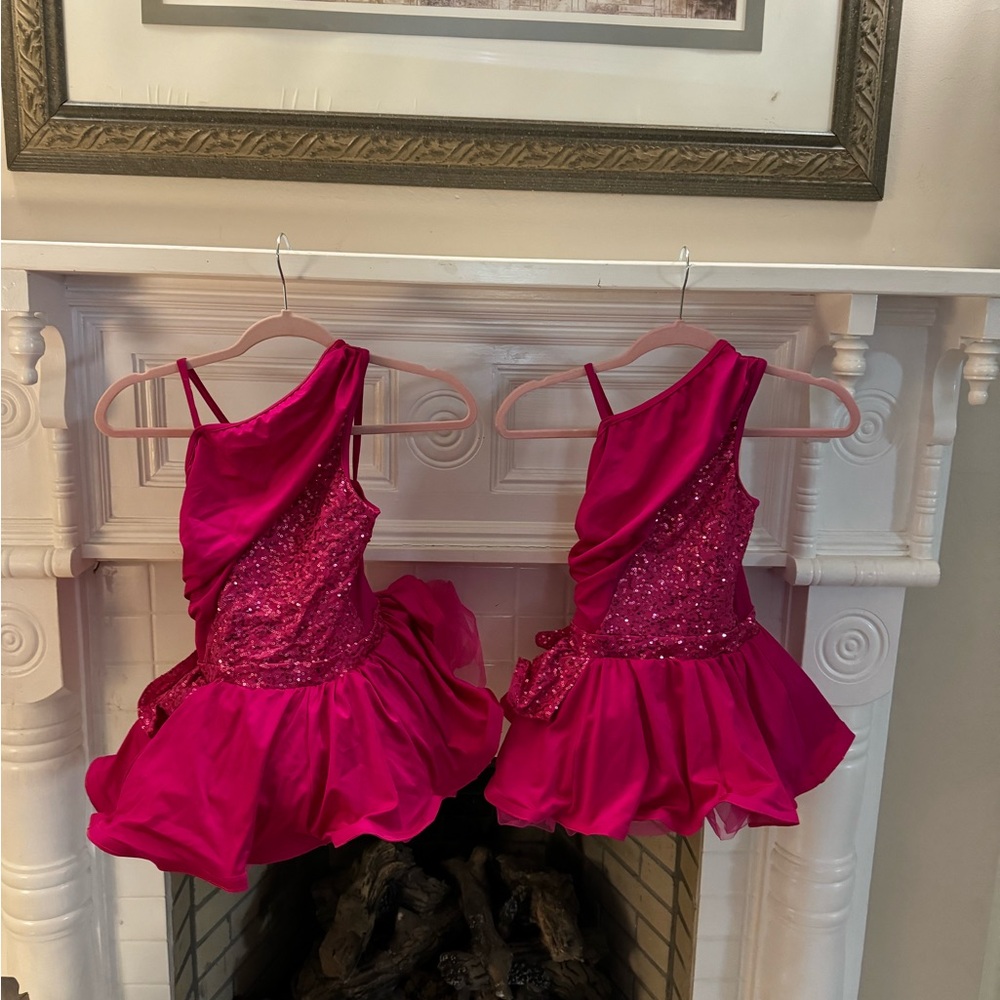 Two matching child size dance costumes, one child, medium, and one child large